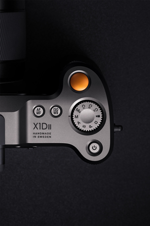 Hasselblad X1D Medium Format Camera Top Down View of aluminium body and Yellow Shutter button